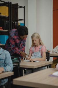 A teacher and student in a classroom